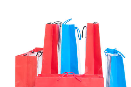 Several gift or shopping bags in different size in close-up isolated on white backgroundの写真素材