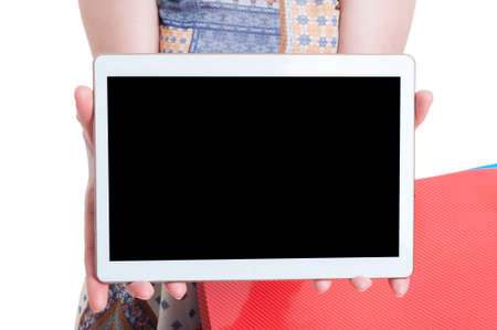 Online modern shopping concept with closeup of tablet with blank screen in female hand with...