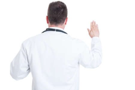 Back view of doctor or medic swearing or having the Hippocratic oath isolated on white background with copy space areaの写真素材