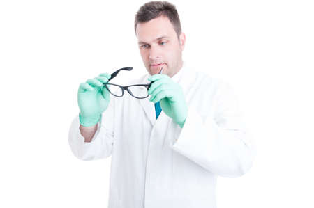 Male scientist preparing and looking at his glasses isolated on white backgroundの写真素材