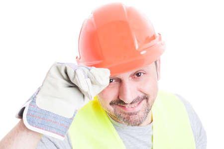 Welcoming concept with handsome builder in closeup doing a respect gesture isolated on white...