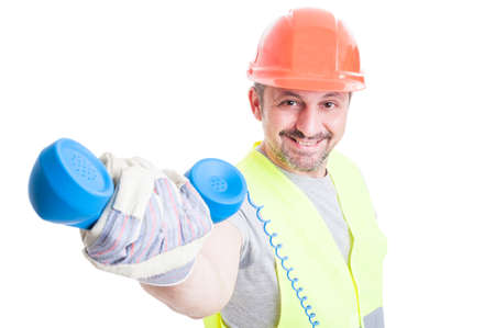 Attractive smiling builder giving a retro receiver as communication concept isolated on white backgroundの写真素材