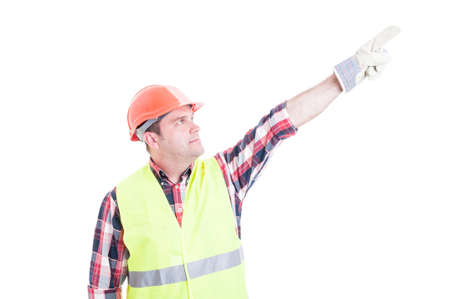 Professional male constructor poiting finger up acting like superhero isolated on white backgroundの写真素材