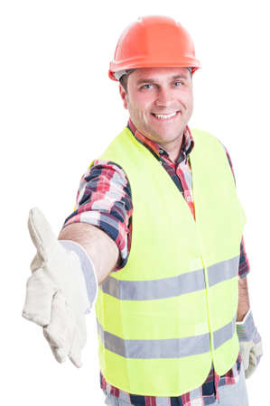 Handsome builder doing hand shake gesture as welcoming concept isolated on white background