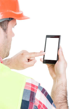 Closeup of builder working on cellphone with empty screen isolated on white background with text areaの写真素材
