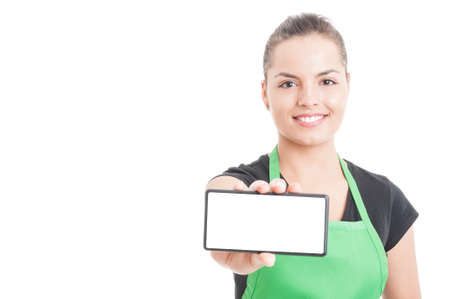 Beautiful supermarket retailer showing cellphone with empty display with text or advertising area isolated on white backgroundの写真素材