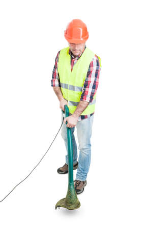 Male constructor using lawn mower for cutting grass isolated on white background