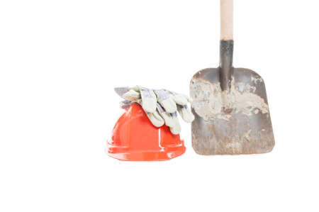 Concept of construction and digging with helmet, protection gloves and shovel isolated on white backgroundの写真素材