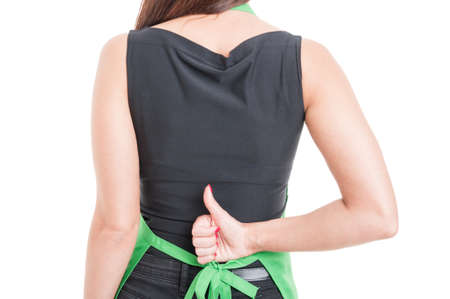 Rear view of supermarket seller showing thumb up or like sign isolated on white backgroundの写真素材