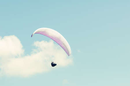 Paragliding in the blue sky on sunny day with copy advertising areaの写真素材