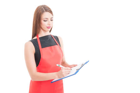 Professional employee writing something on clipboared isolated on white background with copyspaceの写真素材