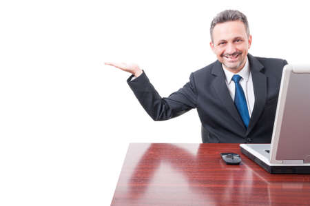 Happy smiling manager showing something in his palm or blank copyspace