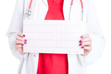 Closeup of heart rhythm and pulse test in woman medic hand isolated on white backgroundの写真素材