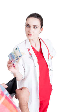 Woman doctor taking bribe from male patient and leave him with empty walet on white backgroundの写真素材