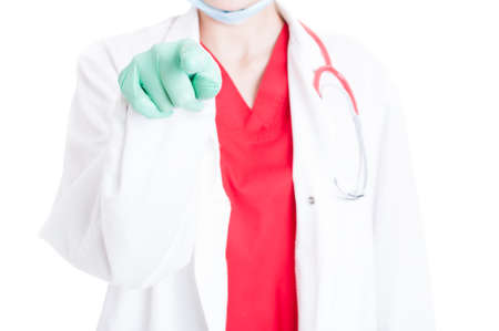 Close-up of doctor finger with gloves touching or pressing virtual screen on white studio backgroundの写真素材