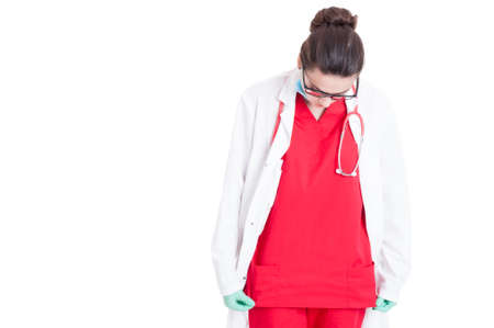 Female medic wearing medical uniform for a new day of work isolated on white with copy spaceの写真素材