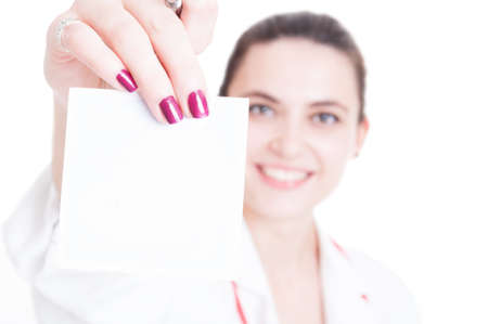 Cheerful assistant holding paper in closeup as treatment prescription concept with copyspaceの写真素材