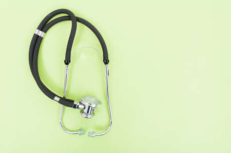 Copyspace image with stethoscope on green background with text area as health conceptの写真素材