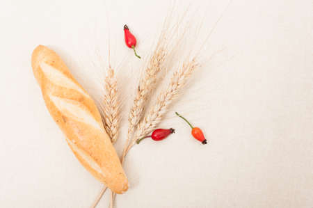 French baguette, wheat and brier in top view as healthy breakfast conceptの写真素材