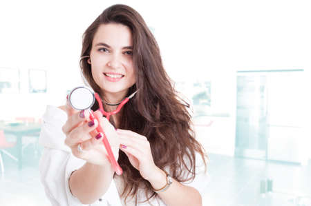 Portrait of trustworthy medic with stethoscope as consultation conceptの写真素材