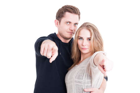 Handsome couple posing as pointing camera wearing autumn casual clothes isolated on white backgroundの写真素材