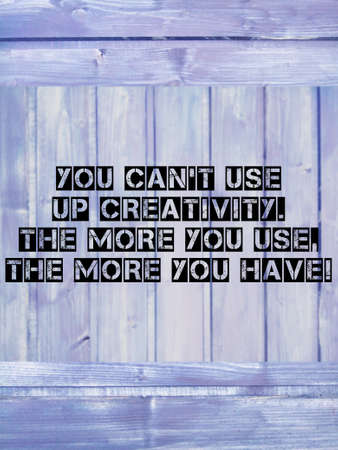 Inspirational quote on wooden and retro background with creative textの写真素材
