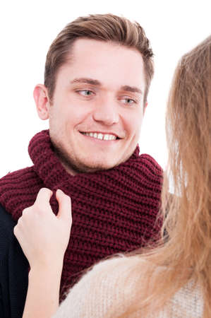 Portrait of man with woman holding man's autumn casual comforter  and smiling like being comfy isolated on white backgroundの写真素材