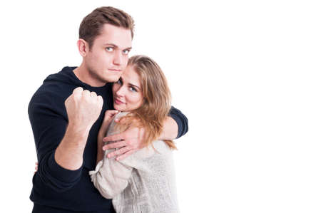 Man defending his woman showing fist like having a fight isolated on white background with copy text spaceの写真素材