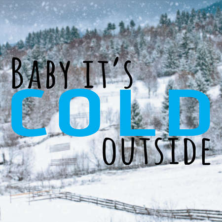 Inspirational text on blurred wallpaper with pine trees and hill covered in snowの写真素材