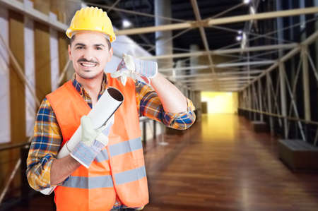 Construction specialist with building plan doing call me gesture as real estate renovation concept