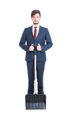 Man wearing suit holding an iron on his jacket isolated on white backgroundの写真素材