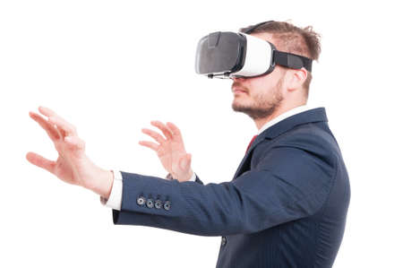 Attractive young businessman wearing vr glasses as virtual reality concept isolated on white backgroundの写真素材
