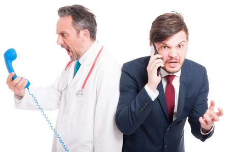 Crazy medic or doctor and businessman screaming at someone on the phone isolated on whiteの写真素材