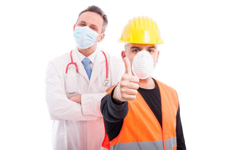 Trustworthy constructor and doctor showing thumb up being confident isolated on white backgroundの写真素材