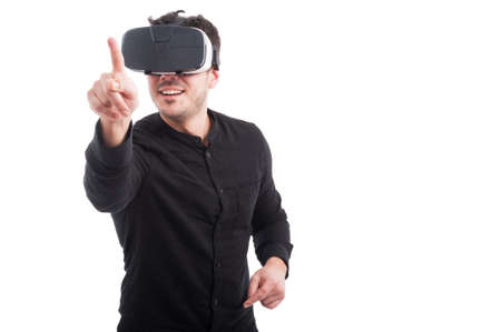 Man using VR glasses touching something on transparent screen with copyspace isolated on white...