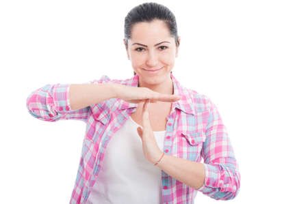 Young female doing a break or time out gesture with hands isolated on white background