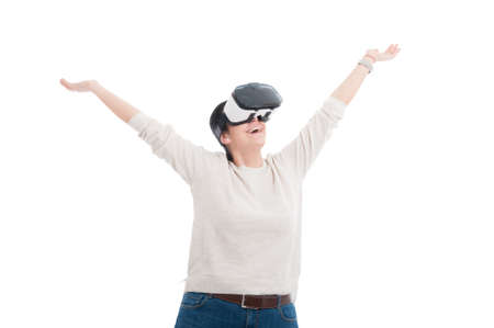 Cheerful pretty girl with 3d glasses looking relaxed and excited in virtual world isolated on white