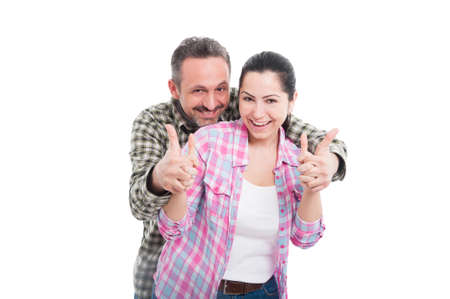 Beautiful intimate couple hug each other and showing like gesture on white backgroundの写真素材