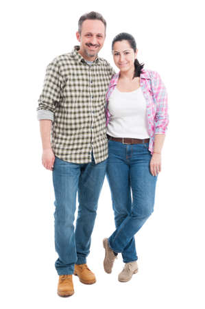 Affectionate young couple embracing and looking happy together isolated on white backgroundの写真素材
