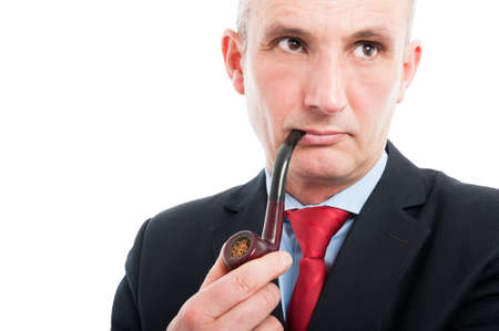 Portrait of middle age business man smoking pipe isolated on white background with copy text spaceの写真素材
