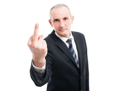 Portrait of middle age elegant man showing obscene gesture wearing suit and tie isolated on white...