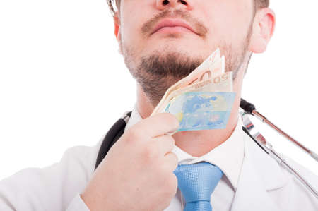 Male medic looking proud in closeup view and wiping his beard with money as satisfaction concept