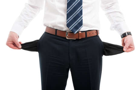 Close-up of elegant man showing his empty pockets wearing suit and tie isolated on white background