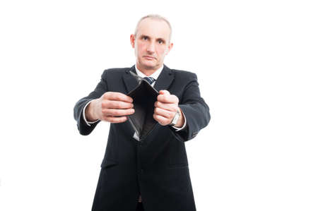 Portrait of senior showing his empty wallet wearing suit and tie isolated on white background