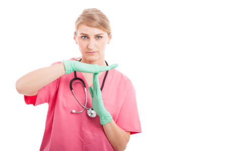 Female medical nurse making time out gesture isolated on white background with copy text spaceの写真素材