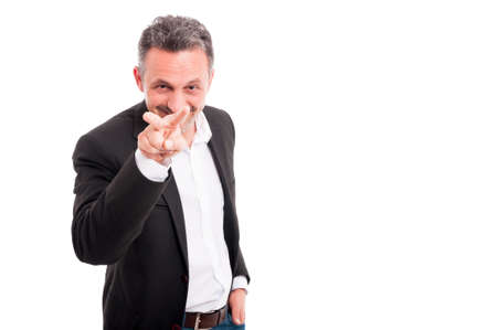 Businessman is looking at you and smiling as spying concept on white background with copytext spaceの写真素材