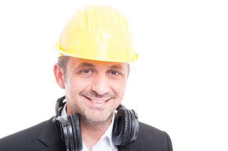 Portrait of contractor wearing hardhat and headset and smiling isolated on white background with copy text spaceの写真素材