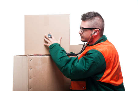 Man checking with stethoscope cardboard box isolated on white backgroundの写真素材
