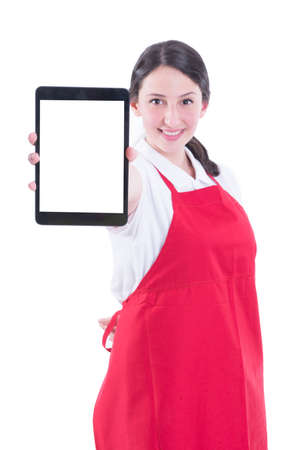 Happy young sales clerk holding modern tablet with empty display in market store isolated on whiteの写真素材