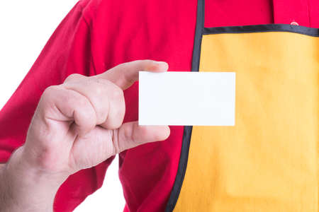 Hypermarket employee holding empty business card in close-up with copy text spaceの写真素材